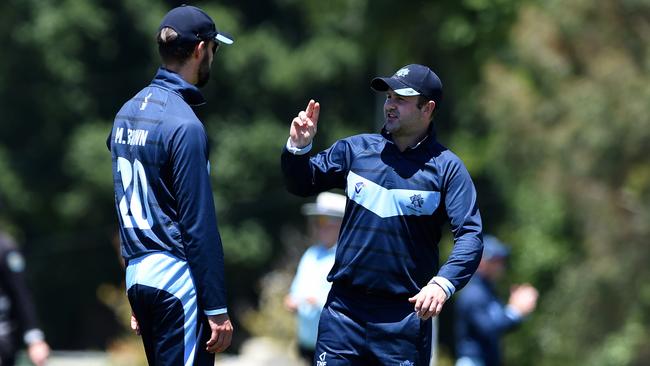 Matt Brown and Chris Weeks have a chat in the field. Picture: Steve Tanner