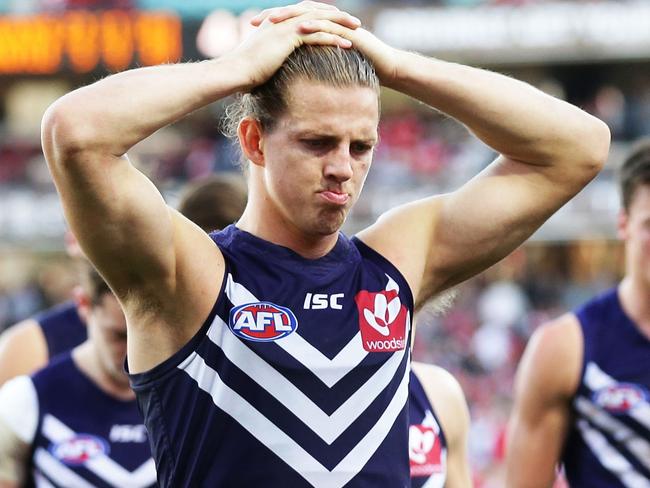 SYDNEY, AUSTRALIA - AUGUST 12:  Nat Fyfe of the Dockers leads the Dockers off the ground as they look dejected after the round 21 AFL match between the Sydney Swans and the Fremantle Dockers at Sydney Cricket Ground on August 12, 2017 in Sydney, Australia.  (Photo by Matt King/AFL Media/Getty Images)