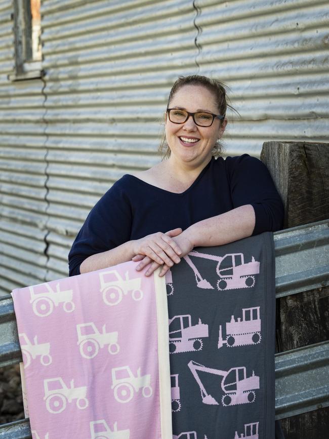 Leroy Mac founder Rebecca McErvale with baby blankets made from their flock’s fleece. Picture: Zoe Phillips