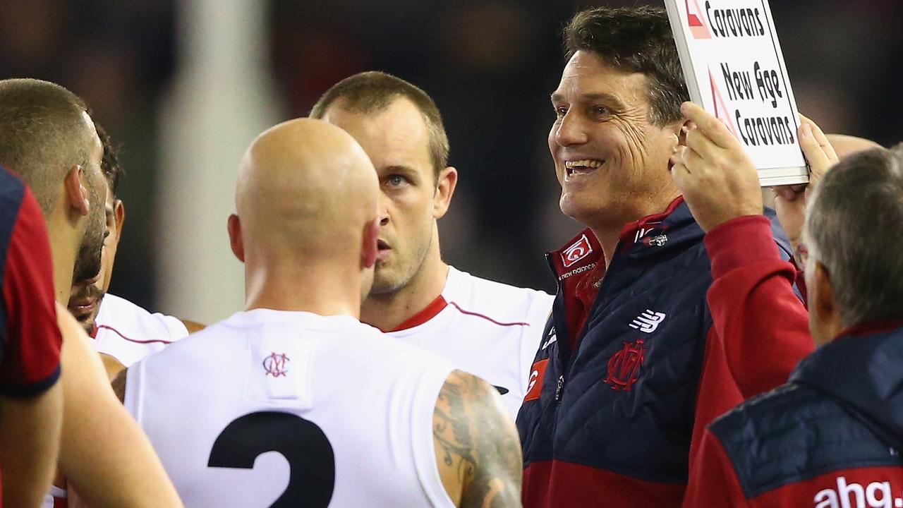 MELBOURNE, AUSTRALIA - JUNE 14: Demons coach Paul Roos speaks to his players at the break during the round 11 AFL match between the St Kilda Saints and the Melbourne Demons at Etihad Stadium on June 14, 2015 in Melbourne, Australia. (Photo by Robert Cianflone/Getty Images)