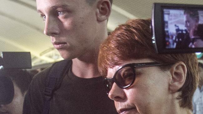 Australian teenager Jamie Murphy walks with his mother to depart to Perth at Bali International Airport, Bali, Indonesia. Picture: AAP Image/Johannes Christo.