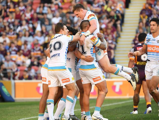 Titans players react after Tyrone Roberts scored a try during the Round 13 NRL match between the Brisbane Broncos and the Gold Coast Titans at Suncorp Stadium in Brisbane, Sunday, June 9, 2019. (AAP Image/Dave Hunt) NO ARCHIVING, EDITORIAL USE ONLY