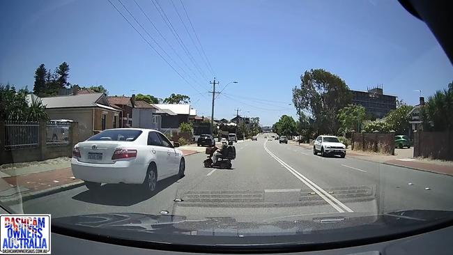 The woman in the scooter attempted to cross the road and a white Toyota Camry collided with her as its view was presumably obscured by the car in the inside lane. Picture: Facebook/ Dashcam Owners Australia