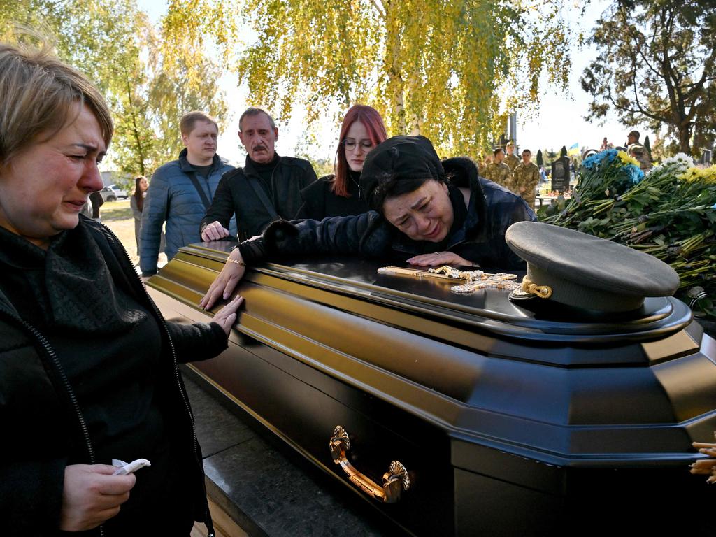 Tetyana Telyzhenko at the duneral of her son, whose body has been missing since his capture in Russia's aborted assault on Kyiv in the first weeks of Russia's invasion. Picture: Sergei Supinsky / AFP