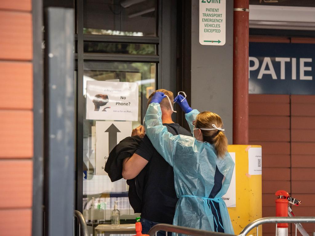 A doctor and patient outside the Royal Melbourne Hospital. Picture: Jason Edwards