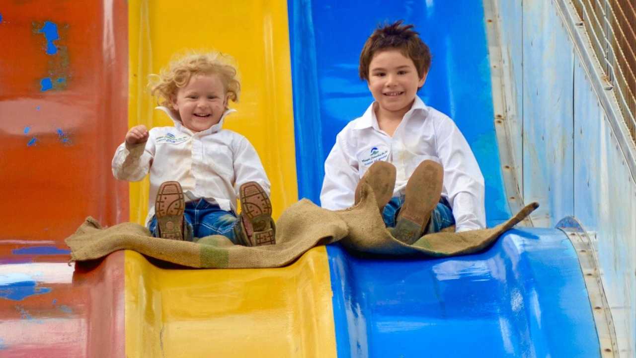 Claire and Hamish Morgan enjoy the rides at the 2019 Mount Perry Show. Picture: Felicity Ripper