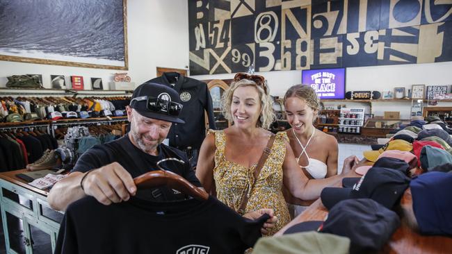 Australian tourists Adam Sadler, his wife Tammy and their daughter Chanel shop at Deus in Canggu. The family returned to Bali for the first time in three years. Picture: Johannes P. Christo