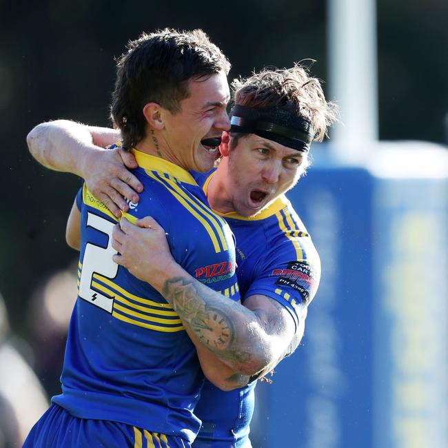 Zac Sun (left) celebrates with skipper Jake Fitzpatrick during his four-try haul. Picture: Sue Graham