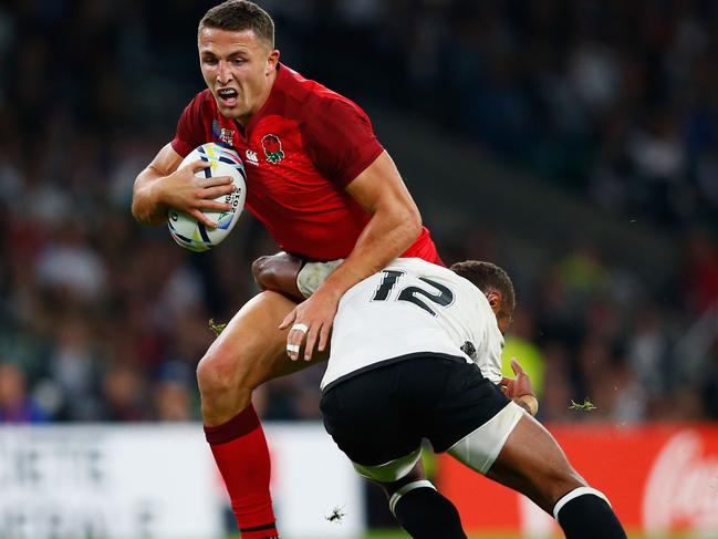 LONDON, ENGLAND - SEPTEMBER 18: Sam Burgess of England is tackled by Gabiriele Lovobalavu of Fiji during the 2015 Rugby World Cup Pool A match between England and Fiji at Twickenham Stadium on September 18, 2015 in London, United Kingdom. (Photo by Mike Hewitt/Getty Images)