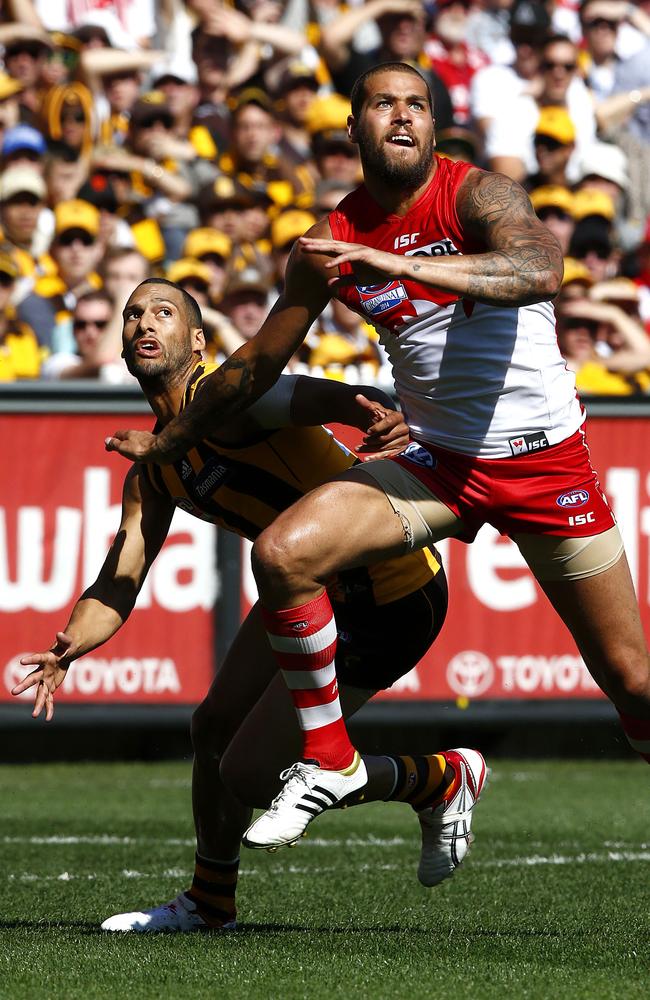 Lance Franklin jostles for position against Hawthorn defender Josh Gibson. Picture: Wayne Ludbey