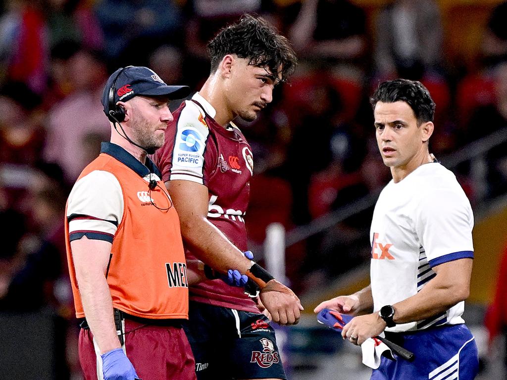 Jordan Petaia leaves the field injured during Queensland’s big win. Picture: Getty Images