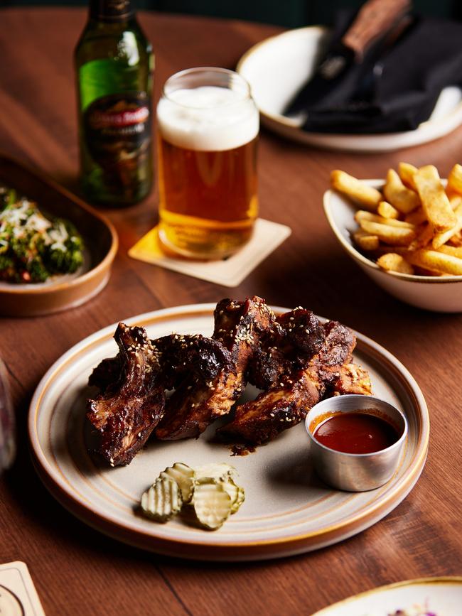 The Longhorn Smokehouse’s BBQ Glazed Pork Ribs are served with Promised Land Tangy BBQ sauce. Picture: Courtesy of the Longhorn Smokehouse