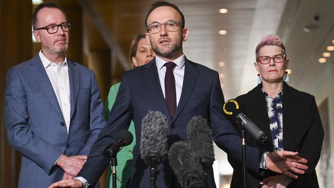 Greens leader Adam Bandt, centre, flanked on his right by Senator David Shoebridge. Picture: Martin Ollman