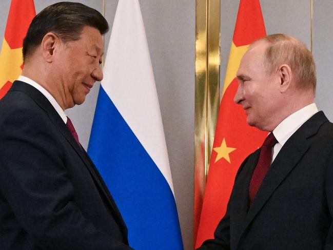 In this pool photograph distributed by the Russian state agency Sputnik, Russia's President Vladimir Putin meets with China's President Xi Jinping on the sidelines of the Shanghai Cooperation Organisation (SCO) member states leaders' summit in Astana on July 3, 2024. (Photo by Sergei GUNEYEV / POOL / AFP)