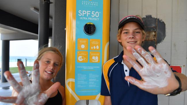 ELIMINATE CANCER:  Esmee Johnson, 11 and Ronan Nagle, 12 at Coolum Surf Club with the new sustainable sunscreen station which will allow the public to access sunscreen. Photo: John McCutcheon / Sunshine Coast Daily