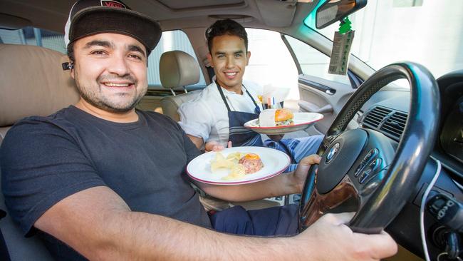 UberEats driver Gonzalo Mendoza and Entrecote chef Juan Carlos Giraldo Vega. Picture: Mark Stewart