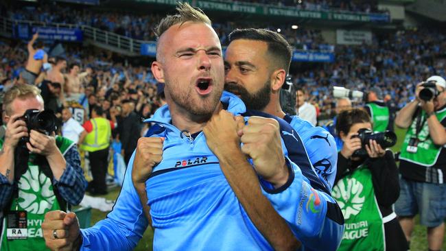 Jordy Buijs and Alex Brosque celebrate Sydney’s grand final win. Picture: Mark Evans