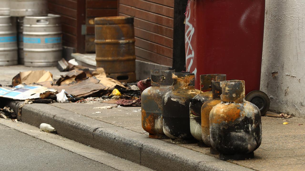 Burnt debris littered the footpath on Union St outside the Sporting Globe. Picture: Alison Wynd