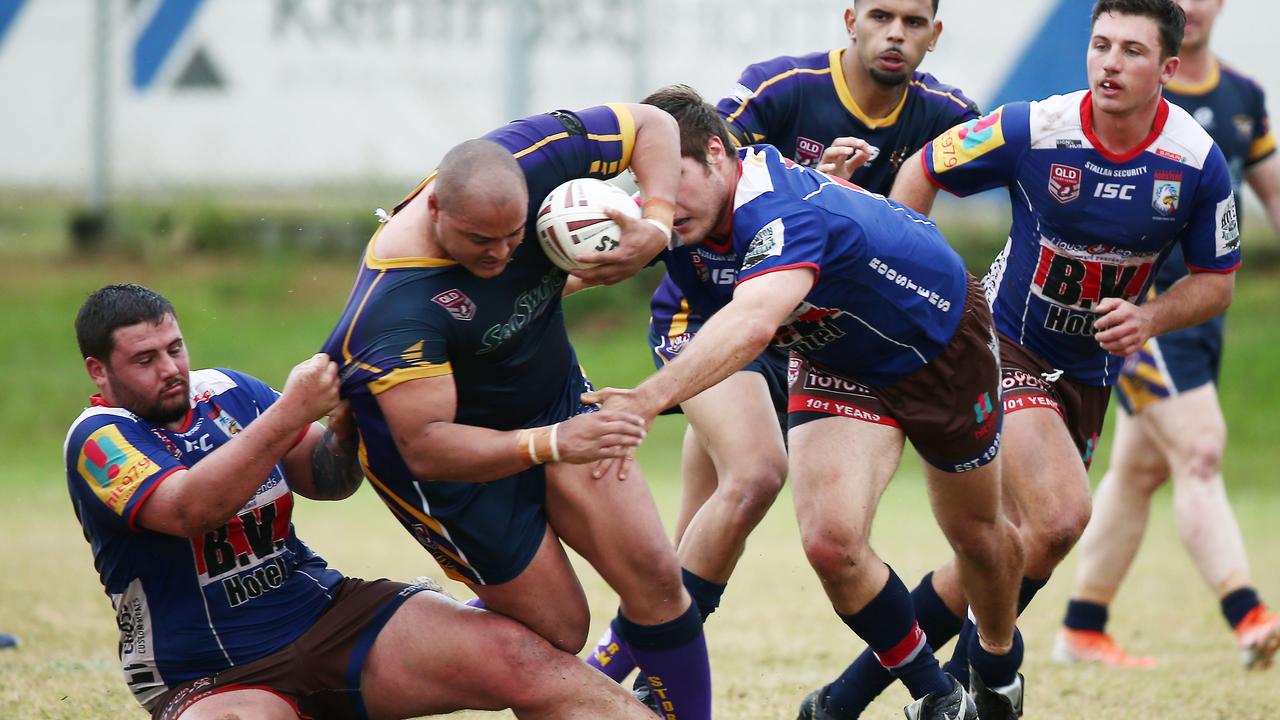 Storms’ Roger Tait is tackled by Roosters players in the Cairns and District Rugby League (CDRL) premiership match between the Edmonton Storm and the Atherton Roosters, held at Petersen Park, Edmonton. PICTURE: BRENDAN RADKE