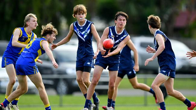 Zeph Creasey of Mornington Peninsula handballs during the South East Region Junior Development Carnival U17 Boys match between Mornington Peninsula and Frankston District at Olympic Park, Rosebud. (Photo by Josh Chadwick)