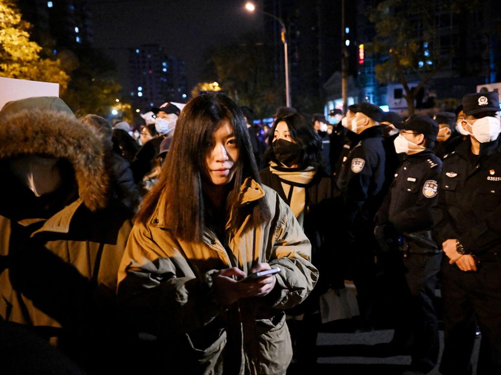 Protesters march along a street during a rally in Beijing. Picture: AFP