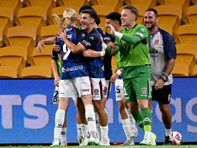 Jets players celebrate Lachlan Rose’s late winner. Picture: Getty Images