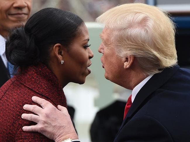 The ‘optics’ might’ve been bad, Ms Obama later said, but she ‘stopped even trying to smile’ as she took in the new administration. Picture: AFP PHOTO/POOL/Saul Loeb