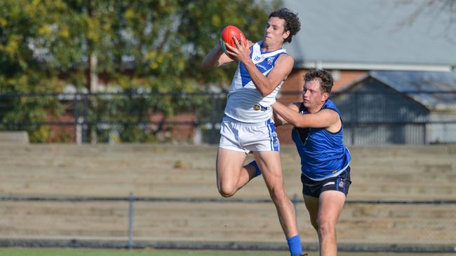 Athelstone forward Tristan Binder marks in front of his Unley opponent. Picture: AAP./Brenton Edwards