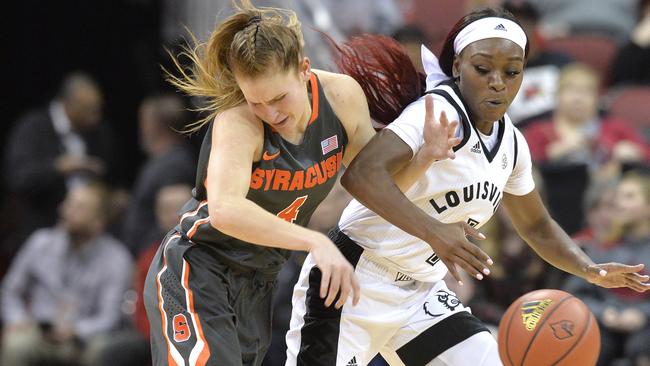 Syracuse guard Tiana Mangakahia scrambles for the ball during an NCAA college basketball game in Louisville, Kentucky. Picture: Timothy D. Easley/AP Photo