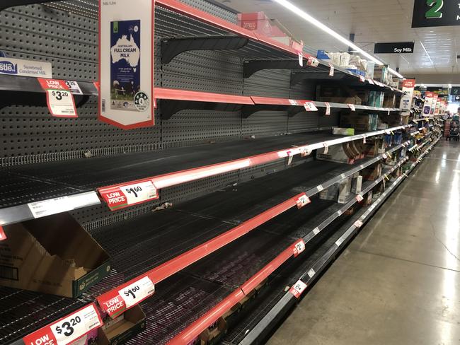 The long life milk shelves left bare at Fairfield Central as shoppers picked up their preparation items for Cyclone Kirrily.