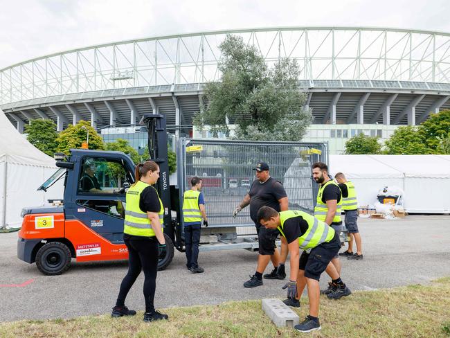 Workers remove barriers outside Ernst Happel Stadium in Vienna, Austria, after Taylor Swift’s gigs were cancelled. Picture: AFP