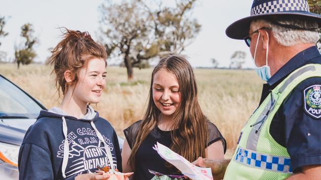 Teenagers give Sergeant Andrew Skein, who has been manning the Frances border checkpoint gifts. Picture: Georgia Rose Photography