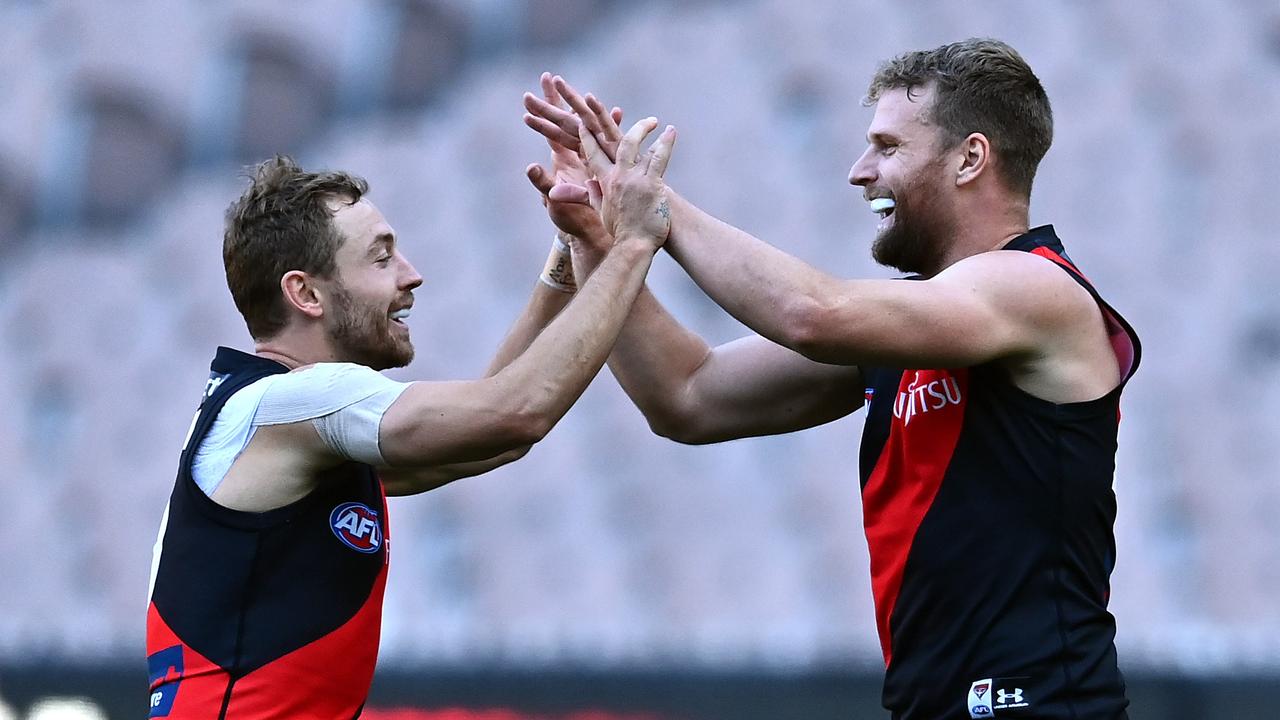 Jake Stringer (right) celebrates a goal with Essendon teammate Devon Smith last year. Picture: Getty Images