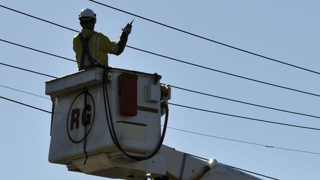 A Ergon worker inspects the lines on Tor St near Hursley Rd after a powerline was brought down, Wednesday, July 06, 2011.   Photo Kevin Farmer / The Chronicle