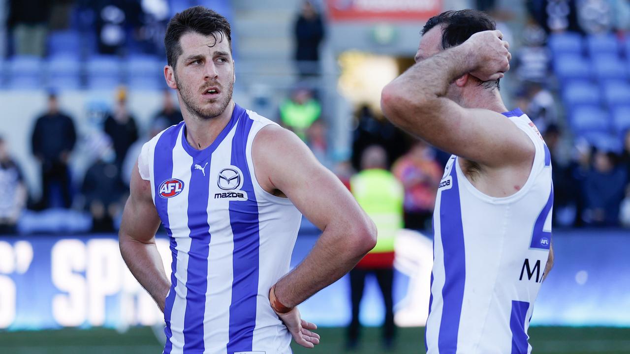 HOBART, AUSTRALIA - APRIL 24: Tristan Xerri of the Kangaroos (left) and Todd Goldstein of the Kangaroos look dejected after a loss during the 2022 AFL Round 06 match between the North Melbourne Kangaroos and the Geelong Cats at Blundstone Arena on April 24, 2022 in Hobart, Australia. (Photo by Michael Willson/AFL Photos via Getty Images)