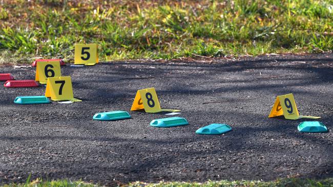 Blood splatter markers are seen at a police crime scene at Frascott Park in Varsity Lakes on the Gold Coast, Thursday, September 5, 2019. A 17 year old male was stabbed to death at the park late Wednesday afternoon. (AAP Image/Dave Hunt)