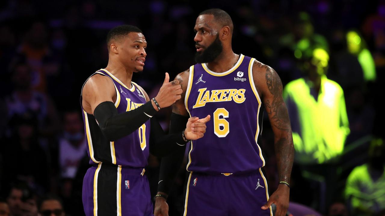 LOS ANGELES, CALIFORNIA - FEBRUARY 16: Russell Westbrook #0 and LeBron James #6 of the Los Angeles Lakers discuss a play during the first quarter against the Utah Jazz at Crypto.com Arena on February 16, 2022 in Los Angeles, California. NOTE TO USER: User expressly acknowledges and agrees that, by downloading and or using this Photograph, user is consenting to the terms and conditions of the Getty Images License Agreement. (Photo by Katelyn Mulcahy/Getty Images)