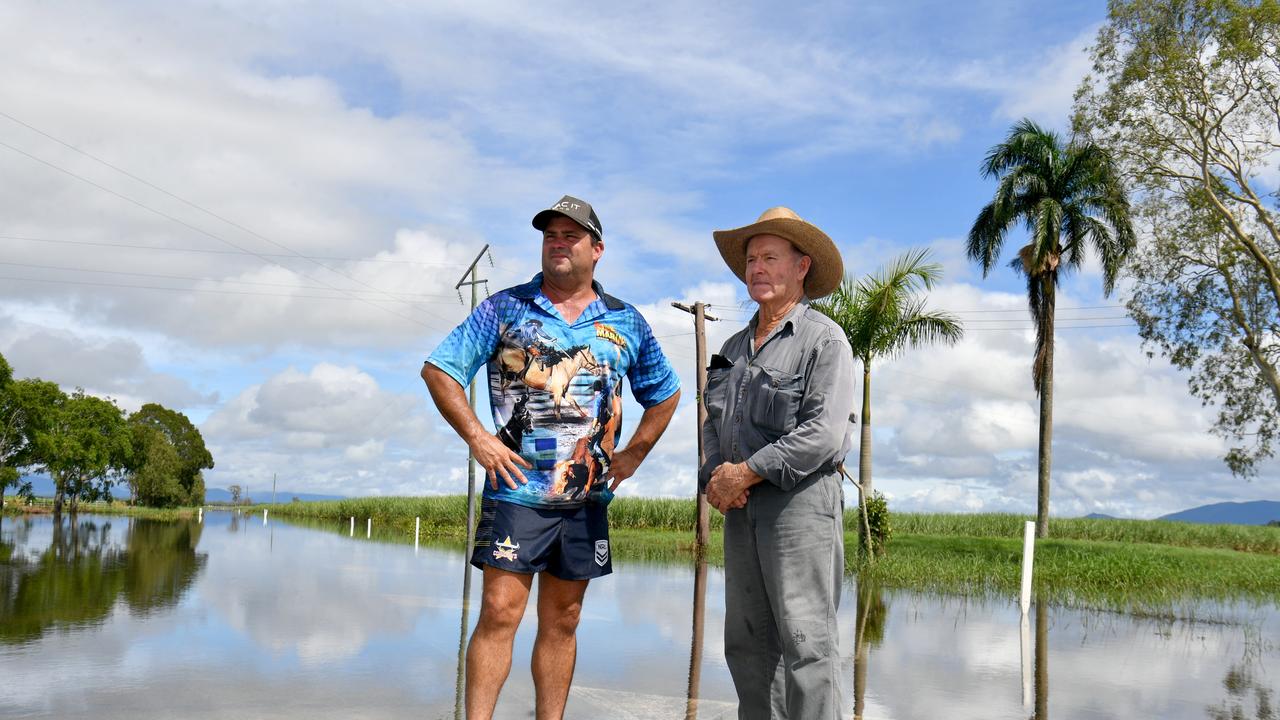 Wednesday February 13. Heavy rain causes flooding in North Queensland. Clean up after flooding in Ingham. Cane farmer Neil Douglas, (right) with son Daryl, was cut off on his property on Pippins Road without communication for days. Picture: Evan Morgan