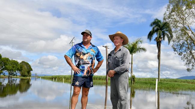 Wednesday February 13. Heavy rain causes flooding in North Queensland. Clean up after flooding in Ingham. Cane farmer Neil Douglas, (right) with son Daryl, was cut off on his property on Pippins Road without communication for days. Picture: Evan Morgan