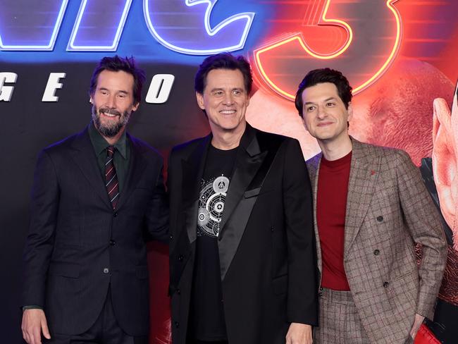 Keanu Reeves, Jim Carreyand Ben Schwartz pose for the cameras at the movie launch. Picture: Amy Sussman/Getty Images/AFP (Photo by Amy Sussman / GETTY IMAGES NORTH AMERICA / Getty Images via AFP)