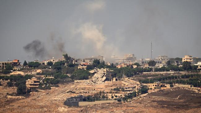 Smoke rises from a village across the border of Lebanon following a strike by the Israeli air force.