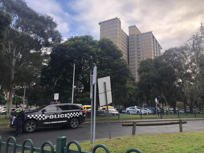 Police outside Melbourne's locked down towers.