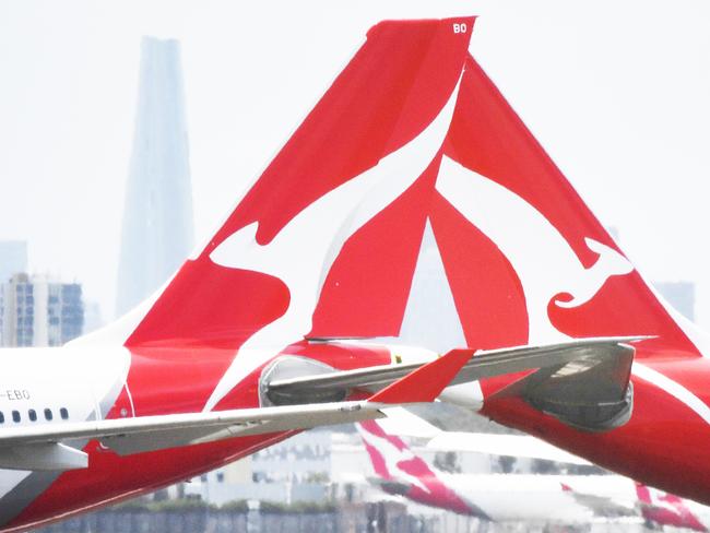 Qantas aircraft are seen at Sydney Airport, Thursday, 24 December 2020. Authorities are urgently investigating how a Qantas crew member contracted Covid-19 after arriving in Darwin from Paris and then flying to Sydney without being tested or quarantined. Federal health authorities are working with Qantas to understand how the man, who landed in Darwin on 17 December after working on a repatriation flight from Paris, became infected. Picture - Sam Mooy/The Australian Newspaperescape january 17 2021doc holiday