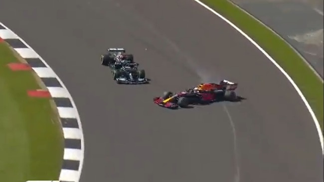 Lewis Hamilton nudges Max Verstappen.