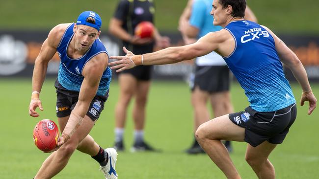 Dom Tyson, left, should play a big role in the midfield for the Kangaroos this season.