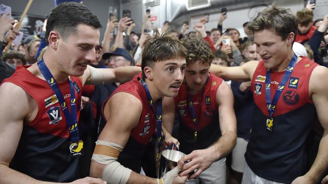 Mt Eliza celebrate in the rooms after their 2024 grand final win. Picture: Andrew Batsch