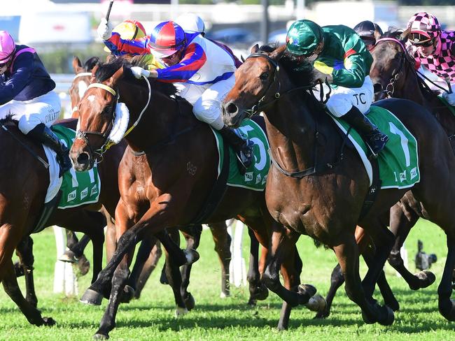 Soxagon (middle, blue & red cap) holds off Alligator Blood (far outside, green colours) to win the BRC Sprint at Eagle Farm under jockey Brad Stewart. Picture: Grant Peters - Trackside Photography