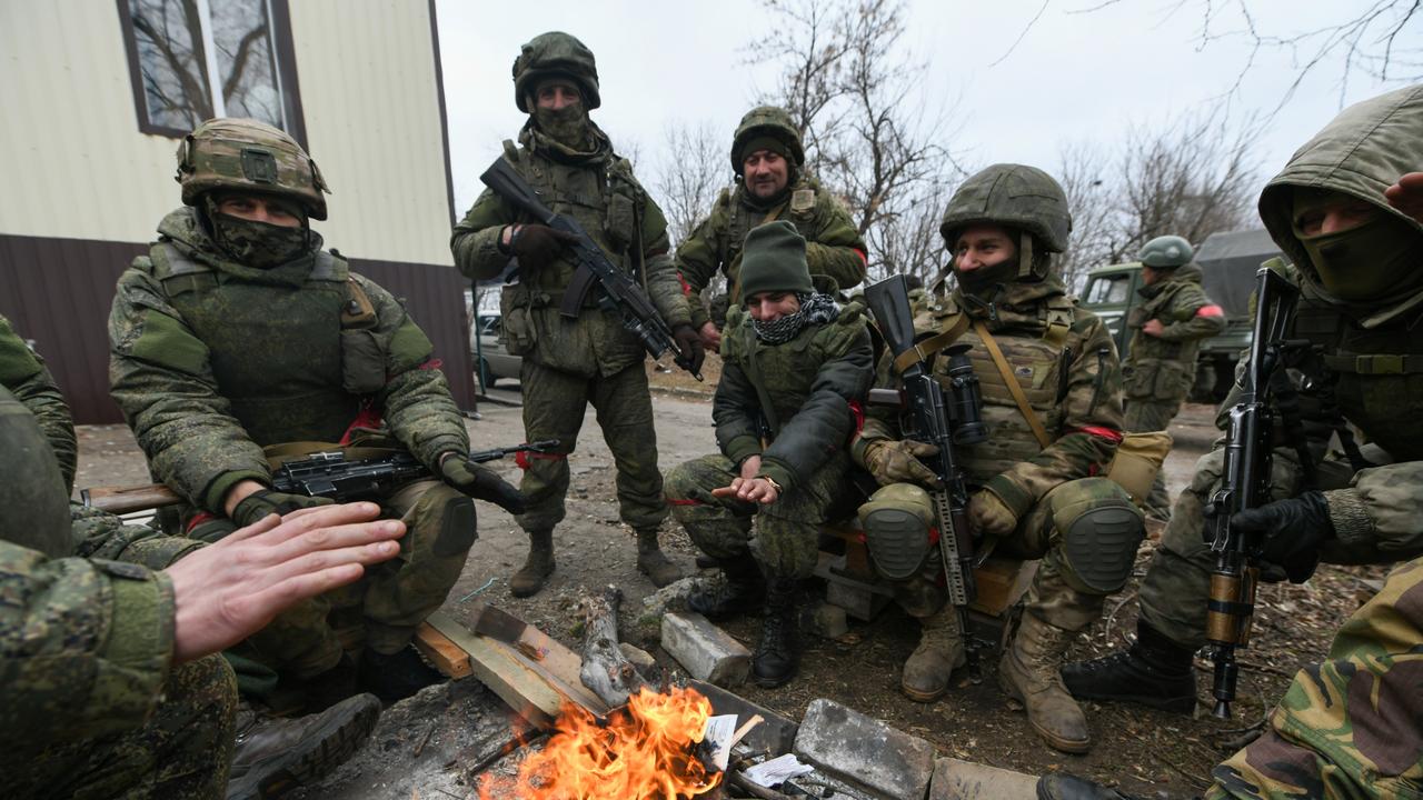Pro-Russian separatists, in uniforms without insignia, gather in the separatist-controlled settlement of Mykolaivka (Nikolaevka) and Bugas, in Donetsk region (DPR) of Ukraine on March 1, 2022. (Photo by Stringer/Anadolu Agency via Getty Images)