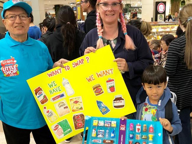 Some parents made signs to get the toys they want.