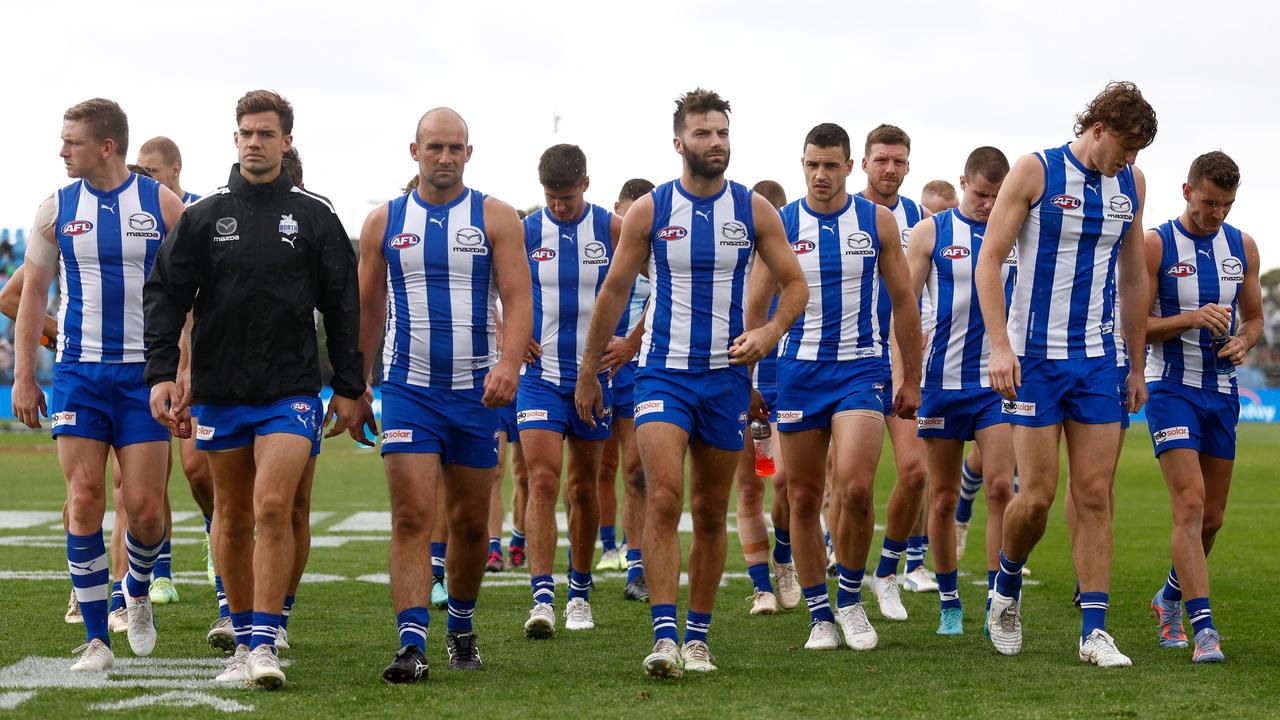 The Kangaroos look dejected after losing. Picture: Michael Willson